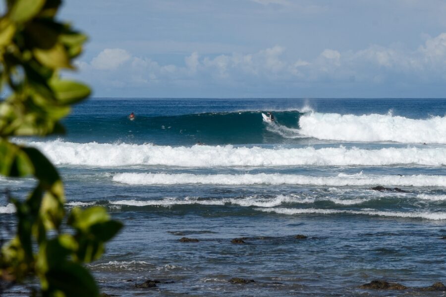 surfer riding wave during costa rica surf trip