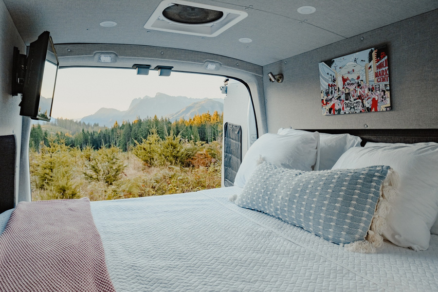 Bed in luxury camper van rental