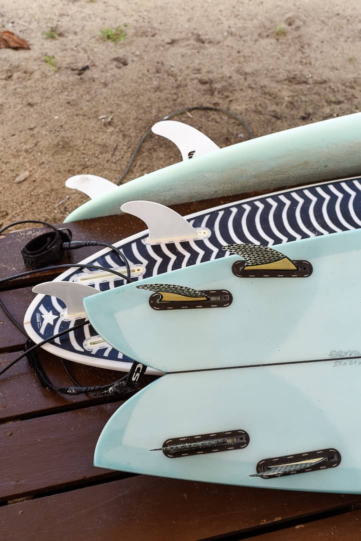 various surfboards tails with fins