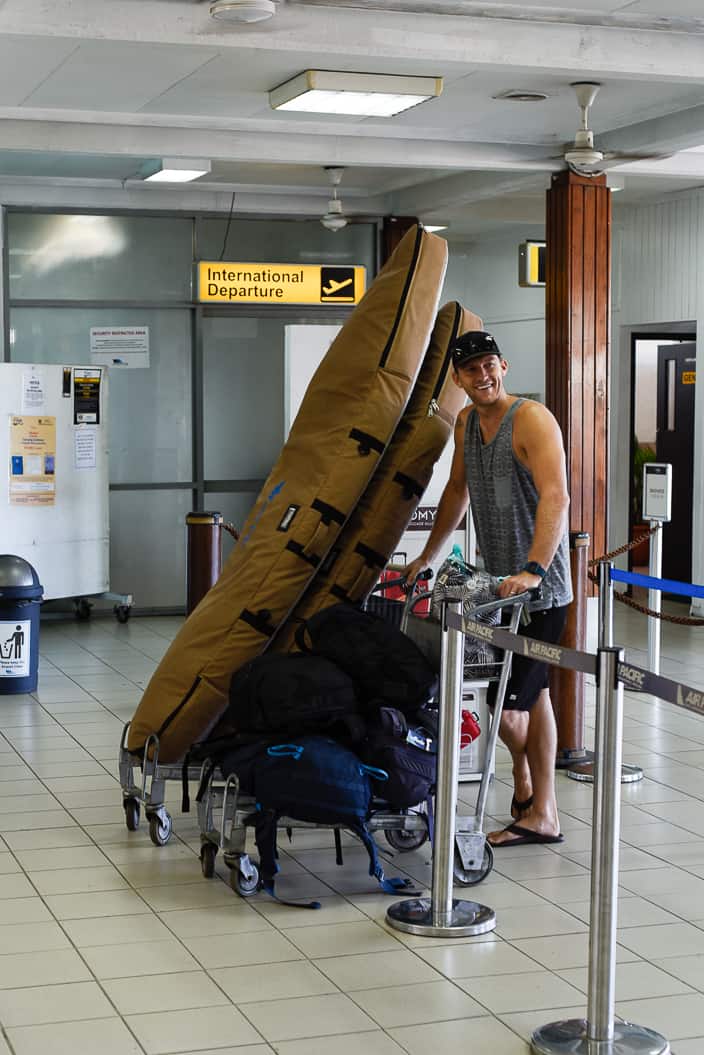 suva fiji airport eric waiting with surfboard bags and luggage