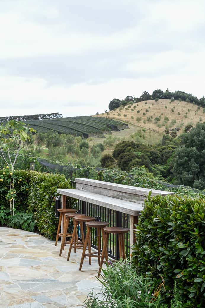 waiheke island barstools and table overlooking vineyard