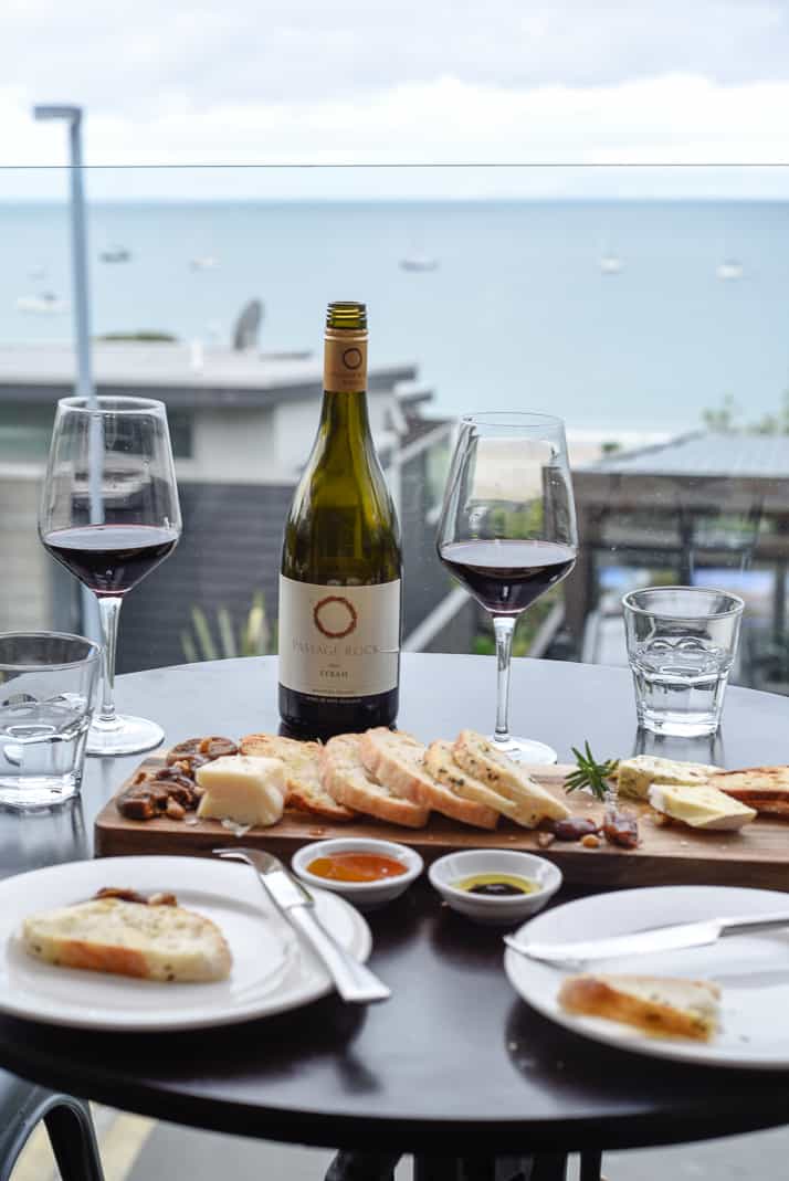 waiheke island wine cheese plate and charcuterie with harbor view