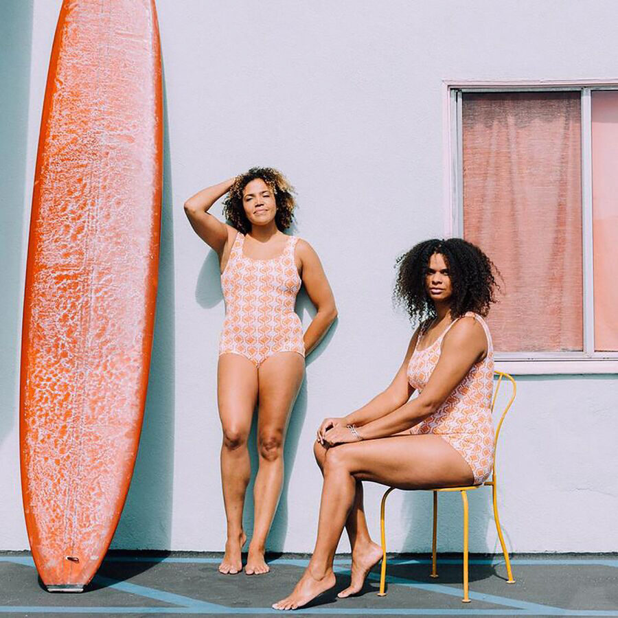 women wearing surf suits