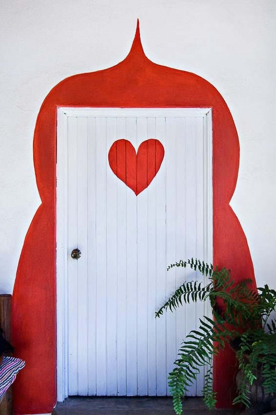 white door with red heard at petit hotel hafa sayulita