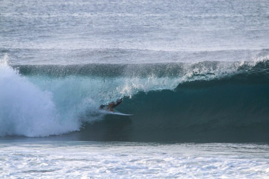 surfer riding barrel in azores portugal