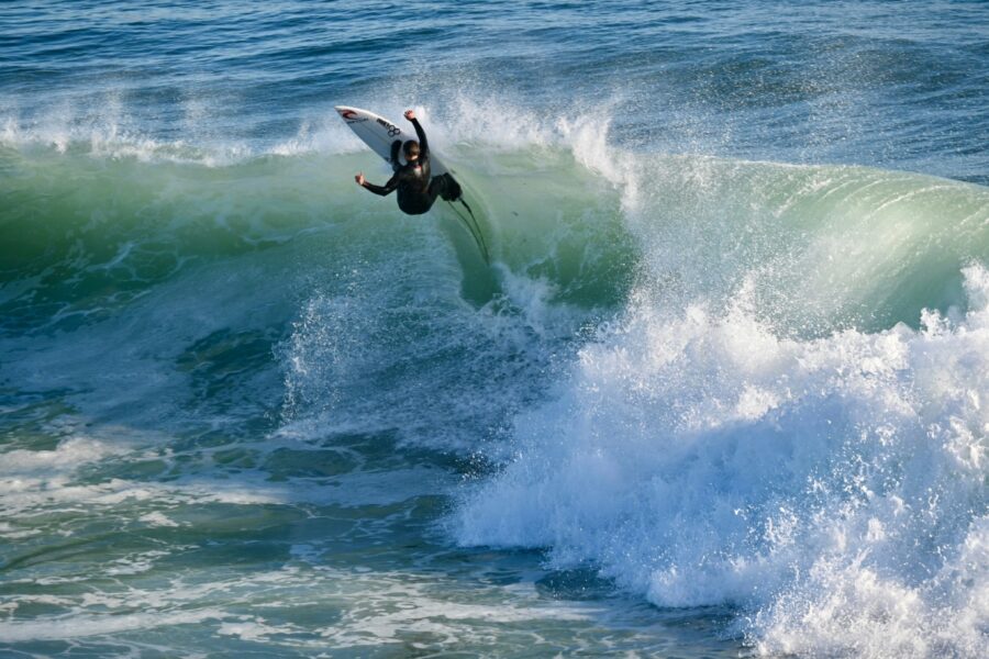 surfer hitting lip at steamer lane california