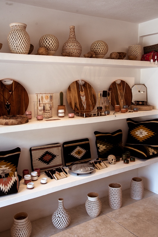 artisan crafts on shelfs in shop punta mita