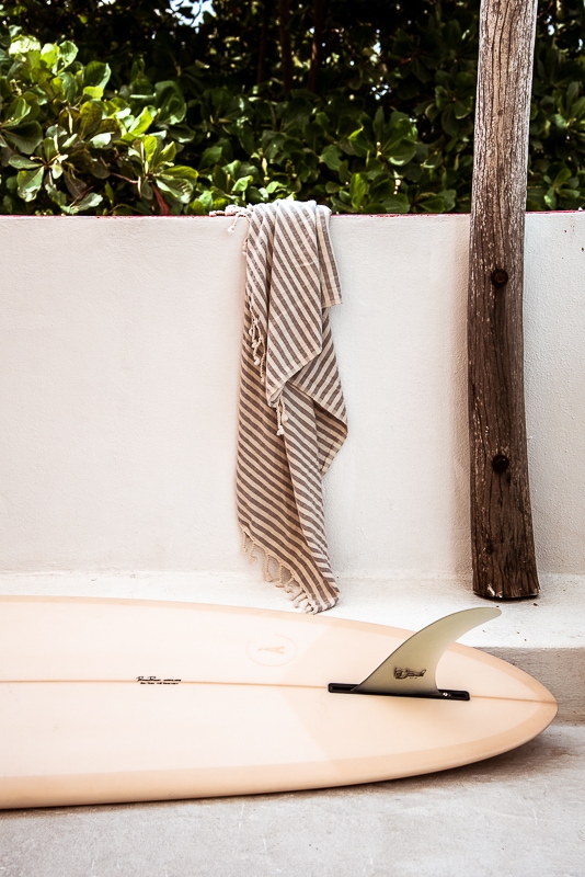 single fin surfboard with turkish towel topical scenery punta mita