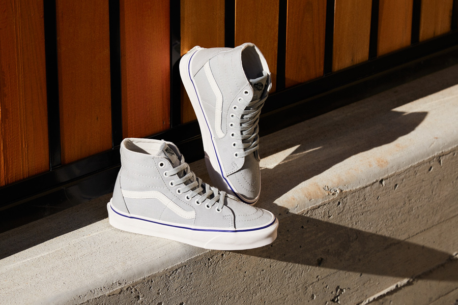 Grey Vans shoes with white stripe