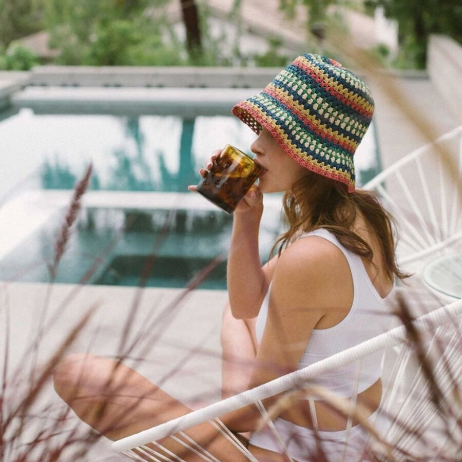 woman wearing colorful bucket hat by surf brand Brixton