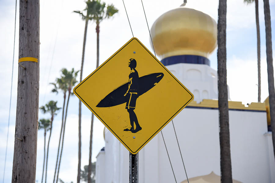 surfer crossing sign