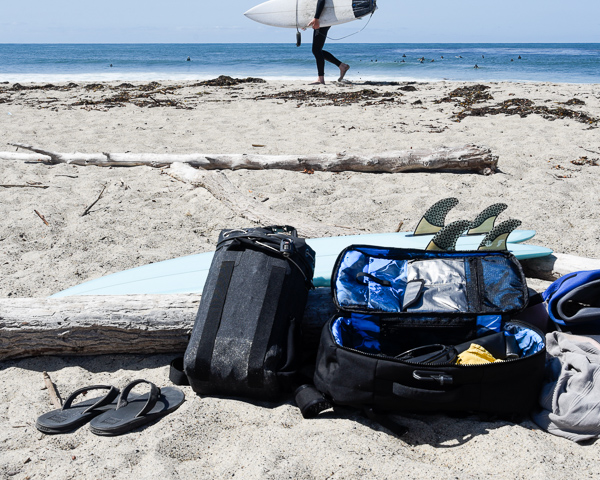 various surf gear and equipment on beach at trestles
