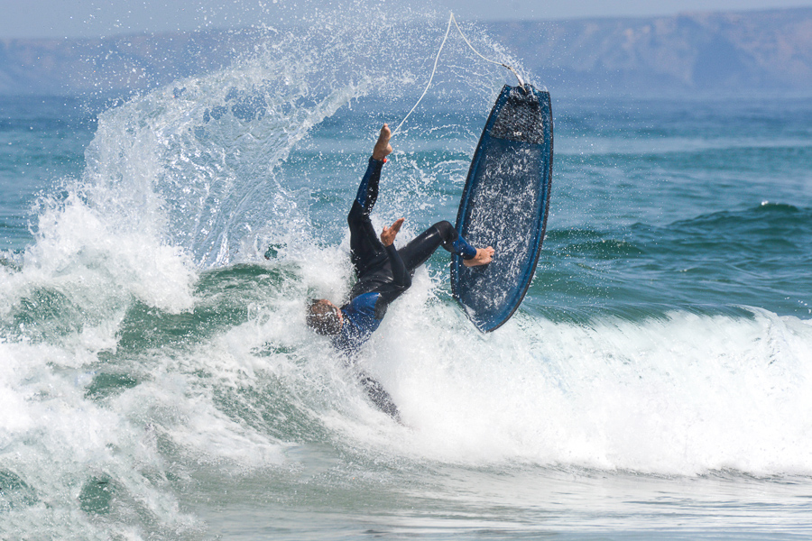 beginner surfer wiping out when learning how to surf