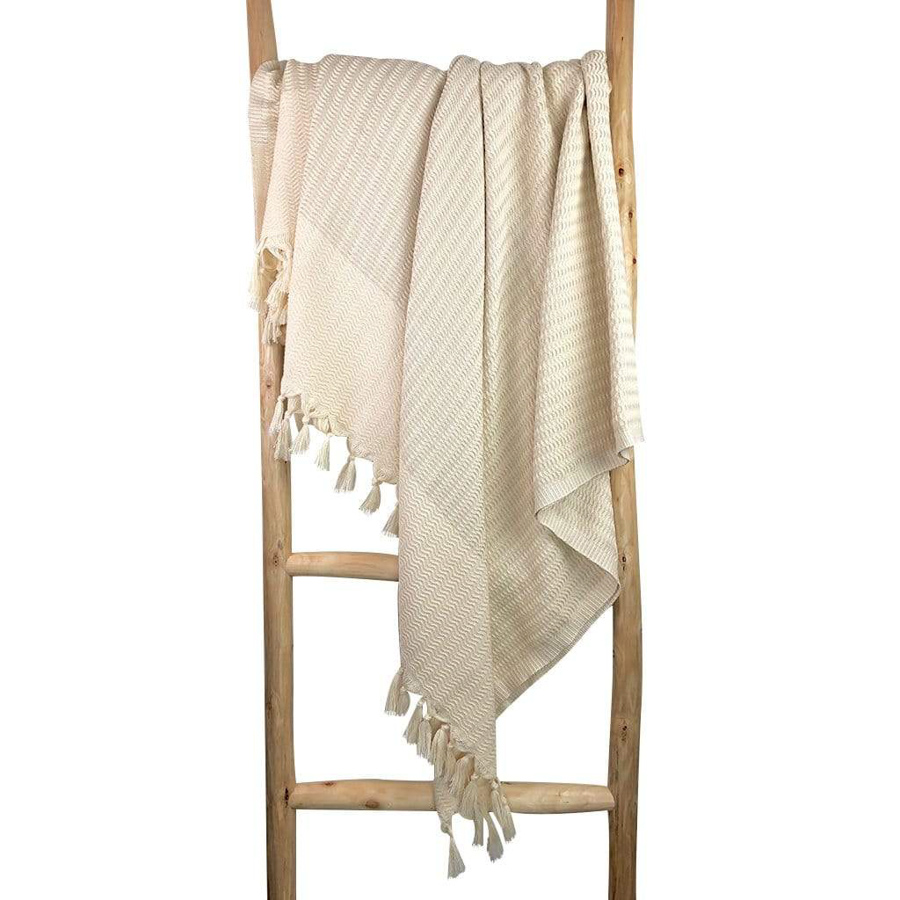 white and beige turkish beach blanket