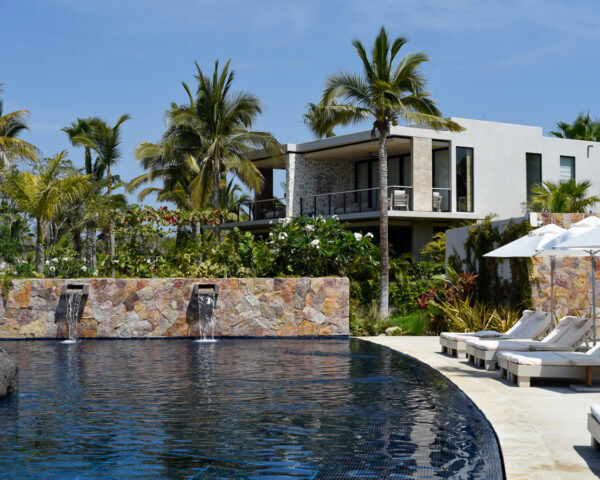 Susurros del Corazon Review / pool side with loungers at luxury resort in Punta de Mita, Mexico