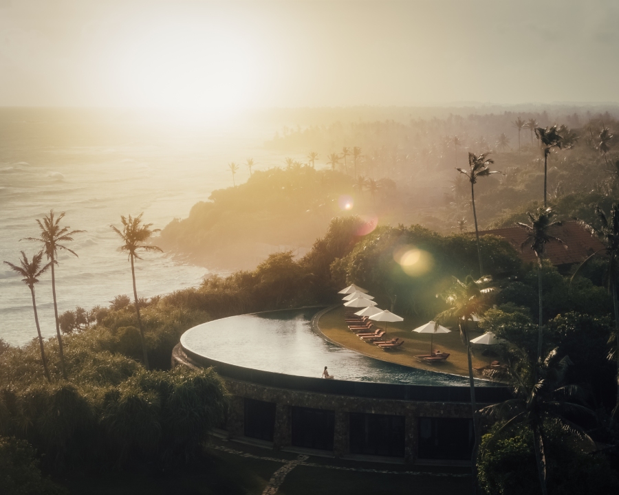 luxury infinity pool overlooking the indian ocean at sunset in weligama, sri lanka