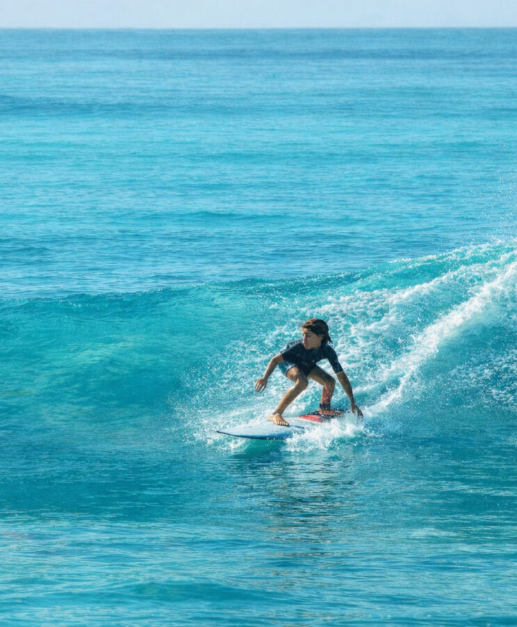 boy surfing small wave